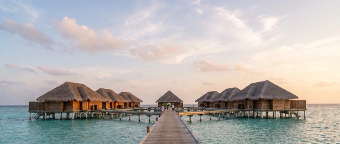 Overwater villas in the Maldives at dusk